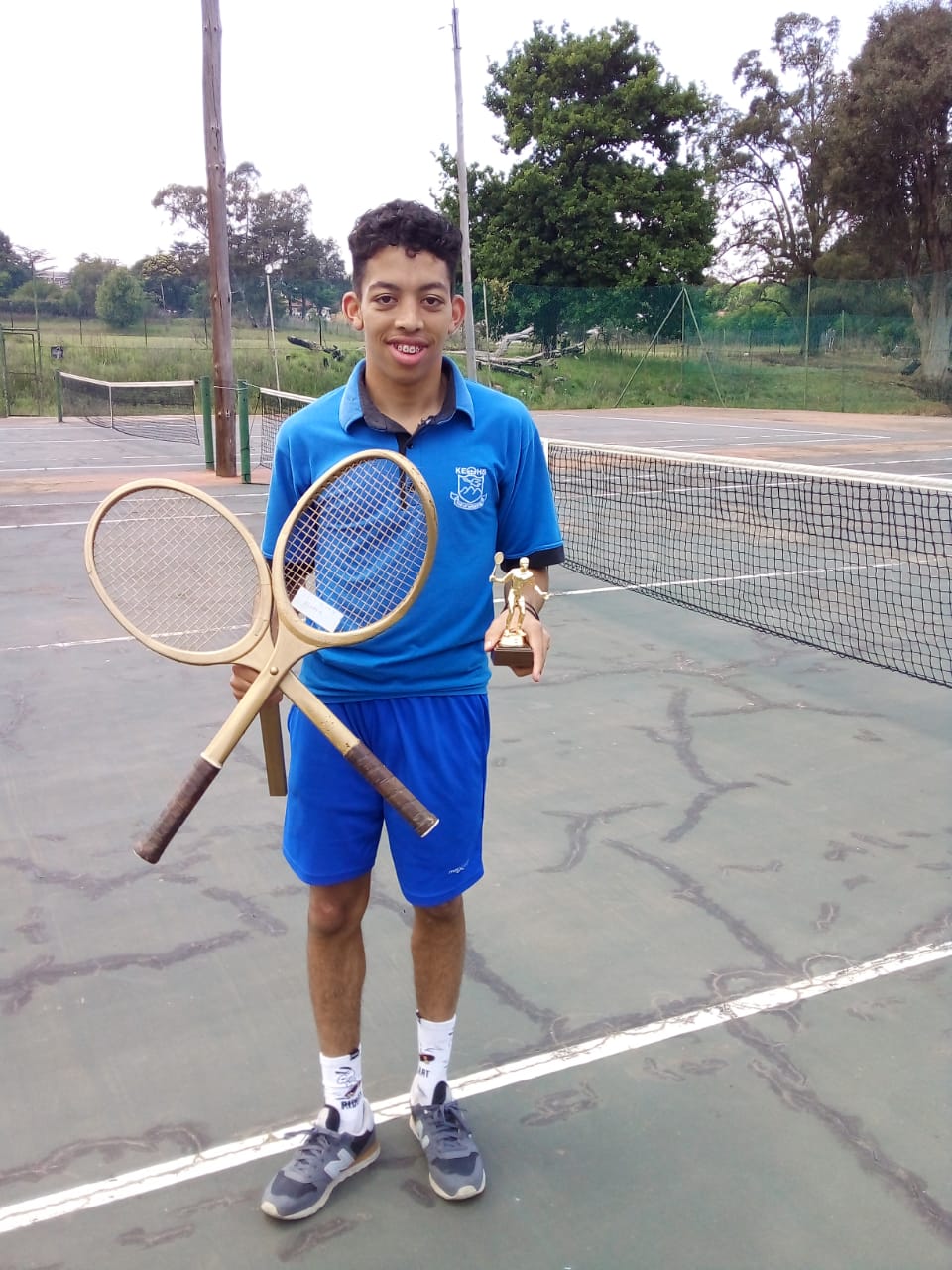 L Dickens Winner of Singles Tennis Tournament