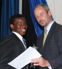 Sinelizwi_Matam_receiving_the_Braam_van_Tubbergh_Trophy_for_Most_Promising_Athlete_Large.jpg